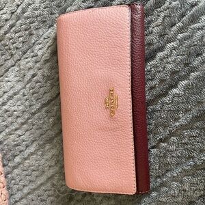 Pink with burgundy Coach wallet